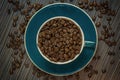 Top view of cup with coffee beans Royalty Free Stock Photo
