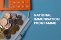 Top view of coins, face mask, calculator and syringe with text NATIONAL IMMUNISATION PROGRAMME