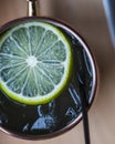 Top view of a cold Moscow Mule drink on a blurred background