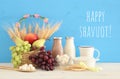 Top view collage image of dairy products and fruits. Symbols of jewish holiday - Shavuot.