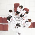 Top view.colleagues shaking hands before a working meeting at the office