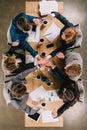 Top view of colleagues at table in office businesspeople teamwork collaboration