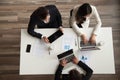 Top view of colleagues working at laptops in office Royalty Free Stock Photo