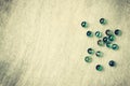 Top view of collection of shiny marbles on wooden background. vintage effect.