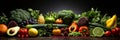 Top view of colorful assortment of fresh and healthy vegetables and fruits on dark background