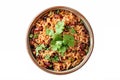 Top view of a colorful bowl of Mexican rice and beans garnished with cilantro presented on a white surface,