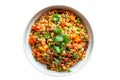 Top view of a colorful bowl of Mexican rice and beans garnished with cilantro presented on a white surface,