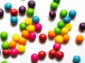 Top view of colorful candies on white background