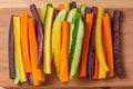 top view of carrots and cucumbers vegetables julienned for snack on wooden board, concept of vegetarian appetizer