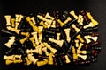 Top view of colorful chess pawns on a black background Royalty Free Stock Photo