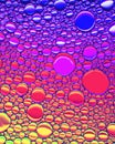 Top view on colorful drops of oil on the water. Circles and ovals Royalty Free Stock Photo