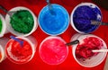 Top view, colorful fabric printing inks in white buckets. Royalty Free Stock Photo