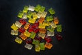 top view of colorful gummy bears lying close to each other on black background Royalty Free Stock Photo