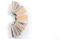 Top view of colorful hardback books in a circle. Open book, fanned pages. Back to school copy space. Education Royalty Free Stock Photo