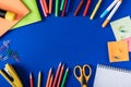 top view of colorful markers and pencils empty textbook and variety stationery