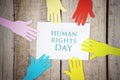 Colorful paper hands with Human Rights Day text