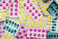Top view of colorful pile of pills in blister packs. Drug use with reasonable concept. Global healthcare wallpaper. Royalty Free Stock Photo