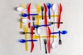Top view colorful plastic utensils on white background. Royalty Free Stock Photo