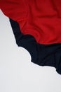 Top view of colorful red and dark blue sport blank sweatshirts isolated on white background Royalty Free Stock Photo