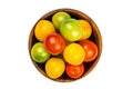 Top view of colorful ripe cherry tomatoes in wooden bowl isolated on white background Royalty Free Stock Photo