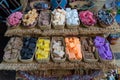 Top view of colorful soaps in thatch baskets on a selling stand