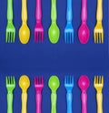 Top view of colorful spoon and fork element on blue color table.flat lay design Royalty Free Stock Photo