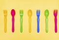 Top view of colorful spoon and fork element on yellow color table.flat lay design Royalty Free Stock Photo