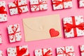 Top view of colorful valentine background made of craft envelope, gift boxes and red textile hearts. Valentine\'s Day concept Royalty Free Stock Photo