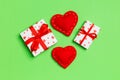 Top view of colorful valentine background made of gift boxes and red textile hearts. Valentine`s Day concept Royalty Free Stock Photo