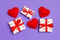 Top view of colorful valentine background made of gift boxes and red textile hearts. Valentine`s Day concept Royalty Free Stock Photo