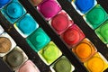 Top view of Colorful Watercolor palette and paintbrush  on a black background Royalty Free Stock Photo