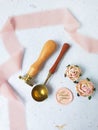 a top view of colorful wax bead and sealing wax with green silk ribbon on an old grey surface Royalty Free Stock Photo