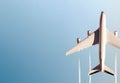 Top view of commercial airplane flying above the clouds