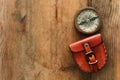 Top view of compass over woodentable background. explorer and adventure concept Royalty Free Stock Photo