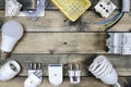 Top view of components for residential electrical installation on ancient wooden background. Royalty Free Stock Photo