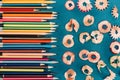 Top view of composition of colorful pencils and cuttings