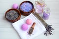 Top view of the composition for the spa and bath. Lavender flowers, sea salt, scented balls and towels on wooden background Royalty Free Stock Photo