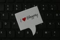 Top view of computer keyboard with speech bubble written with I love blogging