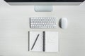 top view of computer screen, mouse, keyboard and notebook with drawn graphic Royalty Free Stock Photo