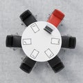 Top view of a conference room. A white round table, six chairs, one of them is red. A laptop and five papers. Office interior. 3D