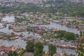 Top view of congested houseboats, shikara, boats, and houses in blue waters of Dal Lake. Jammu and Kashmir, India , Asia