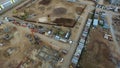 Top view of construction site with crane. Scene. Crane stands above roofs of buildings on construction site with