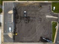 Top view of a construction site with workers on the job, working to re-pave a new parking lot Royalty Free Stock Photo