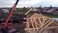 Top view of construction of wooden houses. Clip. Process of construction of country wooden house on background of