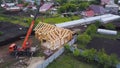 Top view of construction of wooden houses. Clip. Process of construction of country wooden house on background of