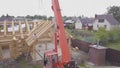 Top view of construction of wooden houses. Clip. Process of construction of country wooden house on background of