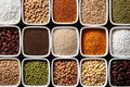 Top view of containers filled with a variety of grains and legumes. The organization and storage in a kitchen in