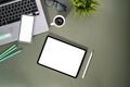 Top view of contemporary workspace with empty screen smartphone, tablet, glasses, laptop and stationery. Royalty Free Stock Photo