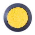 Top view of cooked polenta in gray bowl isolated