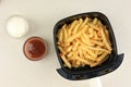 Cooking Potato French Fries using Airfryer Machine, Cooking with No Oil Royalty Free Stock Photo